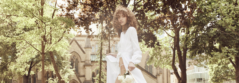 Model wears bridal look with hair by Morgan Roy.