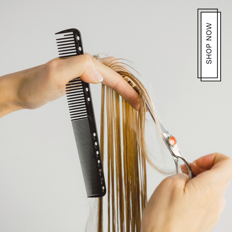 Hair cut with scissors and comb.